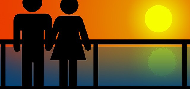 silhouette of couple watching a sunset